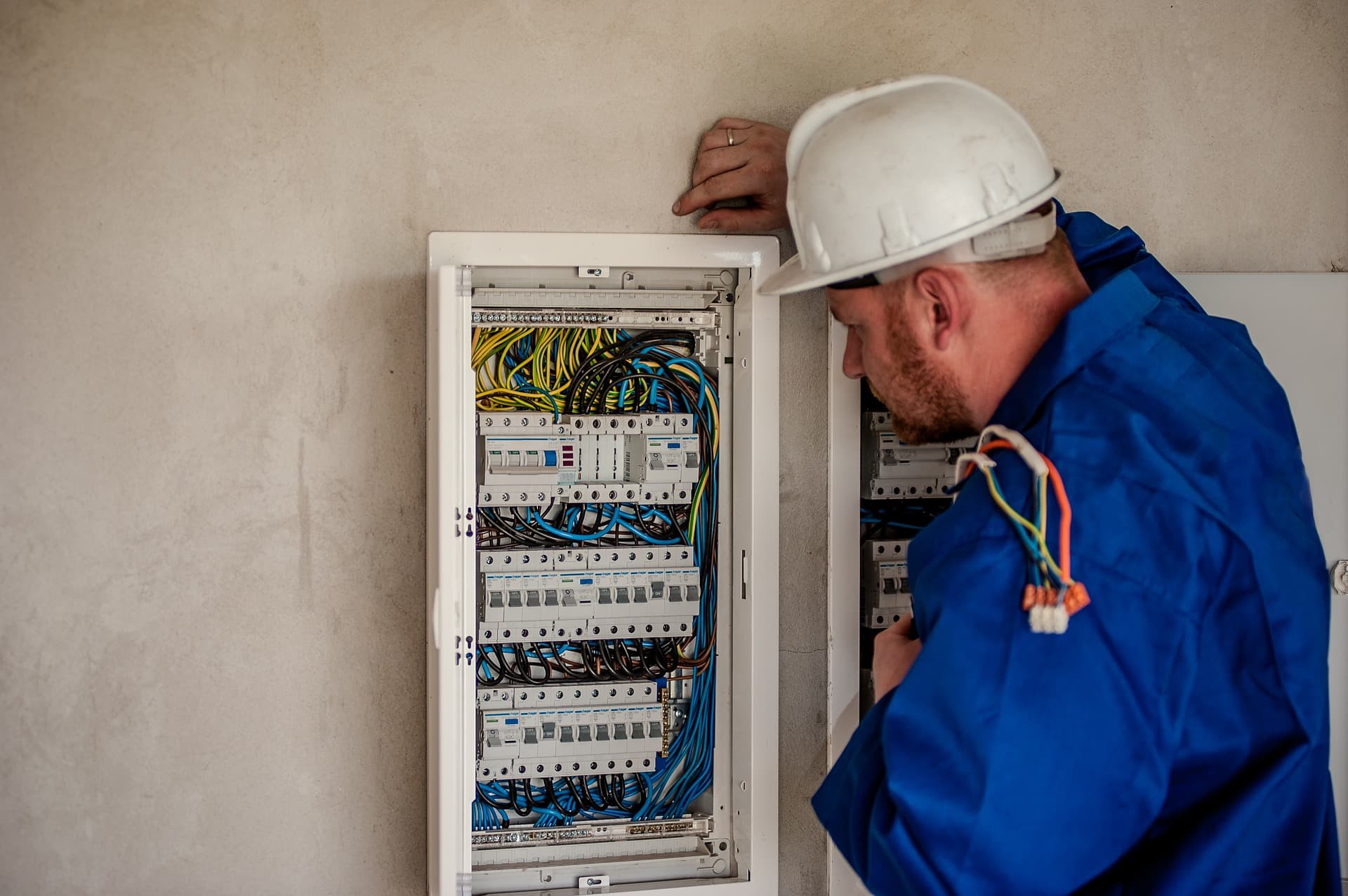 Electrician working on switchboard